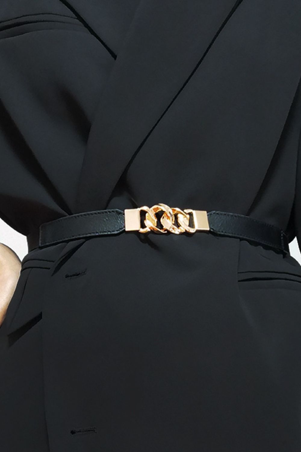 Black faux leather belt with gold chain detail and buckle