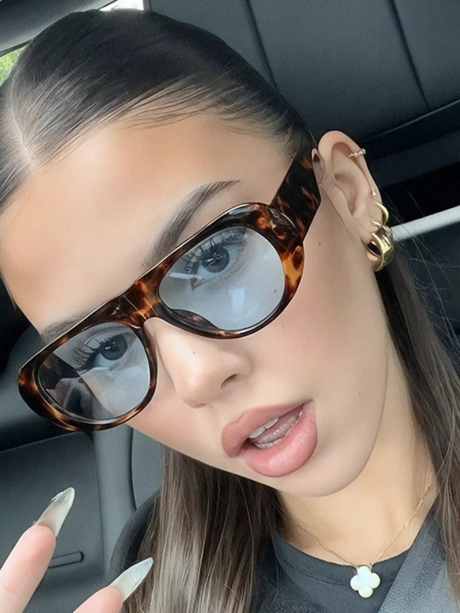 PC Frame material: Polycarbonate Lens material: Polycarbonate Temple material: P sunglasses in Style A with oval silhouette