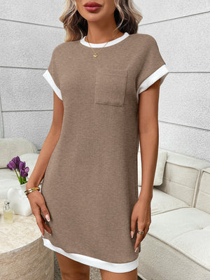 Beige ribbed knit mini dress with white trim and chest pocket.