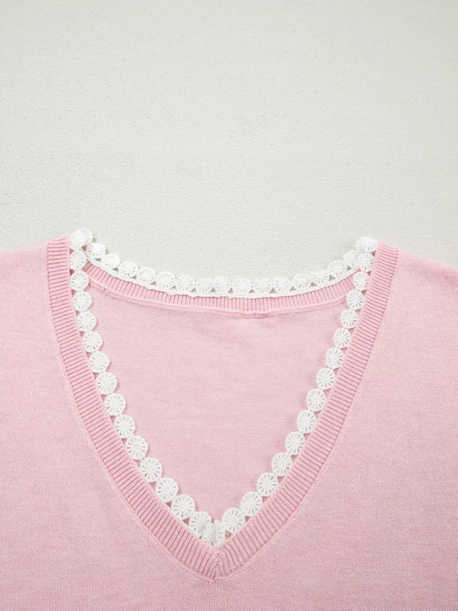 Pink knit v-neck top with white lace trim detail