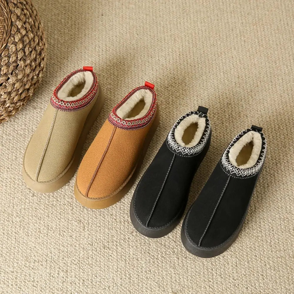 Shearling trim platform mules in black and camel with patterned trim.