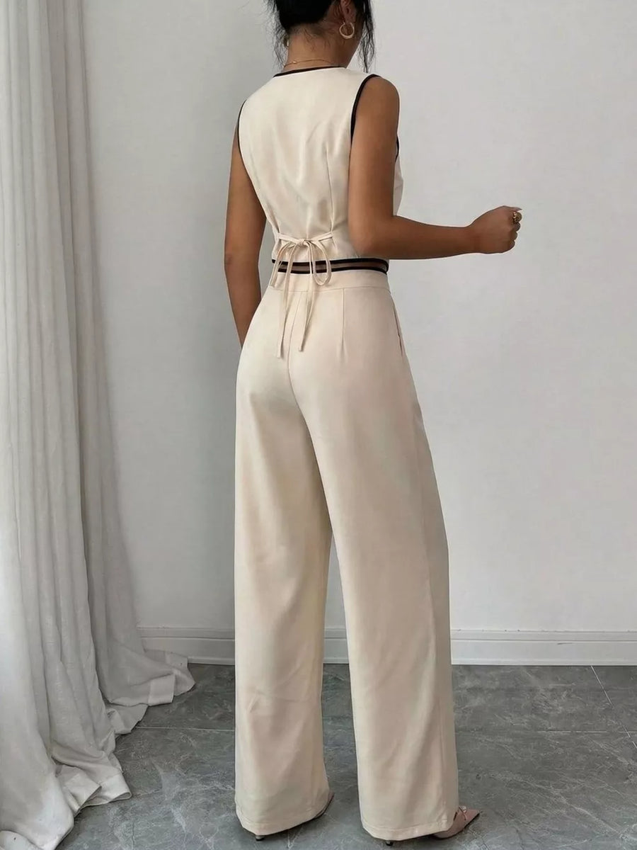 Apricot contrast trim two-piece set with a sleeveless top and wide-leg pants.