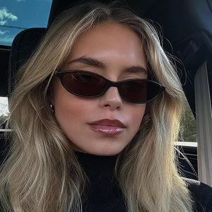 sunglasses in black featuring UV400 protection and oval fit