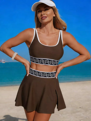 Brown tankini top with white trim and patterned band, paired with a matching skort.