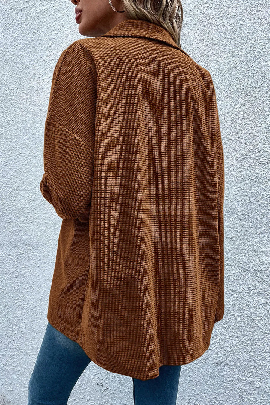 Brown waffle knit overshirt with patch pockets and button-down front.