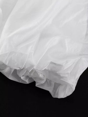 White sheer fabric with ruffled hem detail
