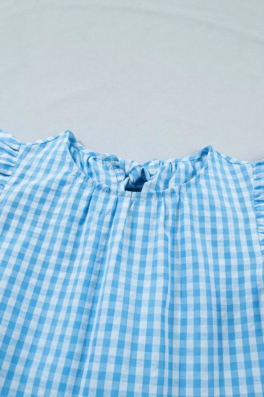 Blue gingham tiered maxi dress with ruffled sleeves and knot back detail