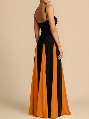 Elegant black and orange maxi dress with spaghetti straps and a flowing skirt.