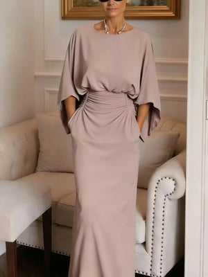 Sophisticated batwing sleeve maxi dress in taupe with ruched waist detail and pockets.