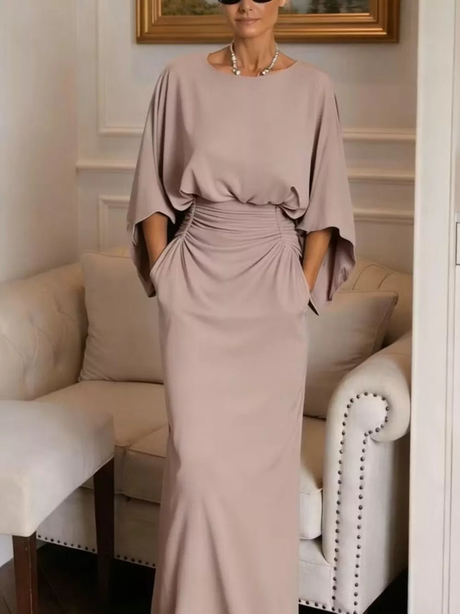 Sophisticated batwing sleeve maxi dress in taupe with ruched waist detail and pockets.