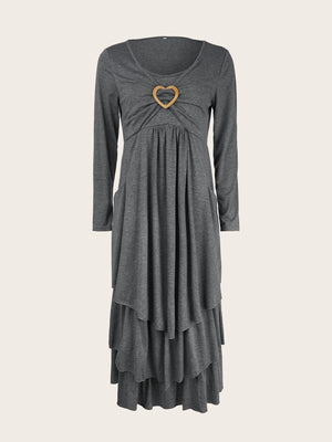 Dark gray tiered midi dress with long sleeves and a heart detail at the neckline.