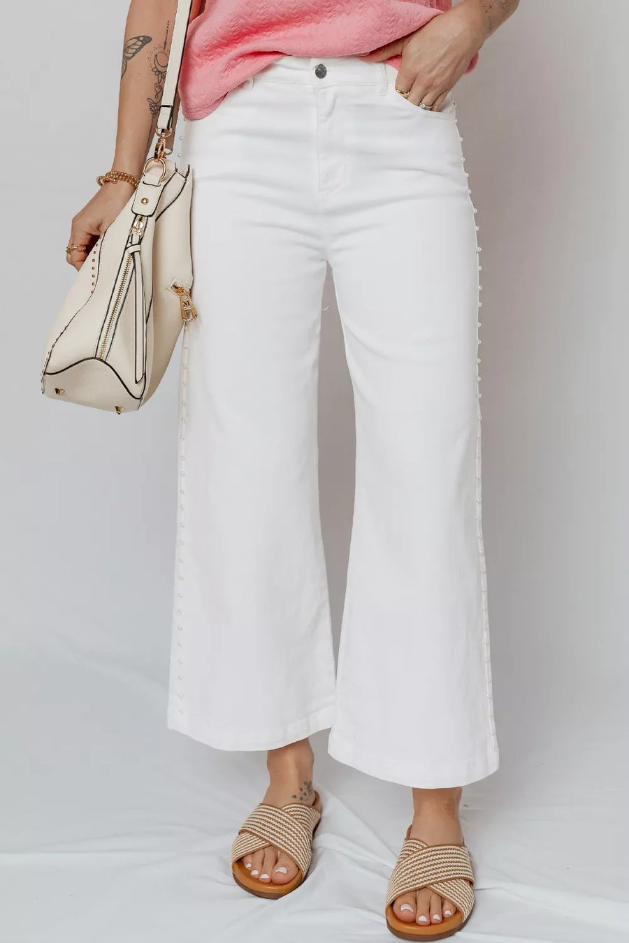 White denim relaxed fit ankle jeans with pearl embellishments down the side seams.
