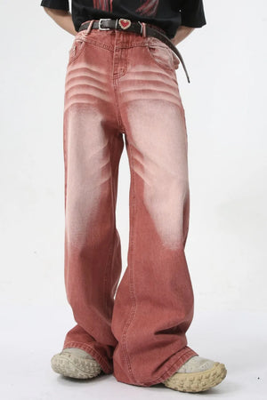 Sunset dip-dye wide leg jeans in rust with a faded effect and relaxed fit.