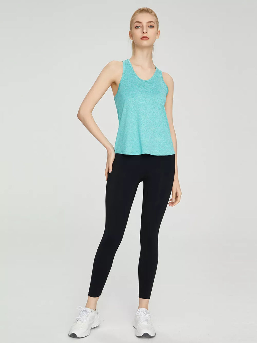 Turquoise heathered tank top with a scoop neck and racerback, paired with black leggings.