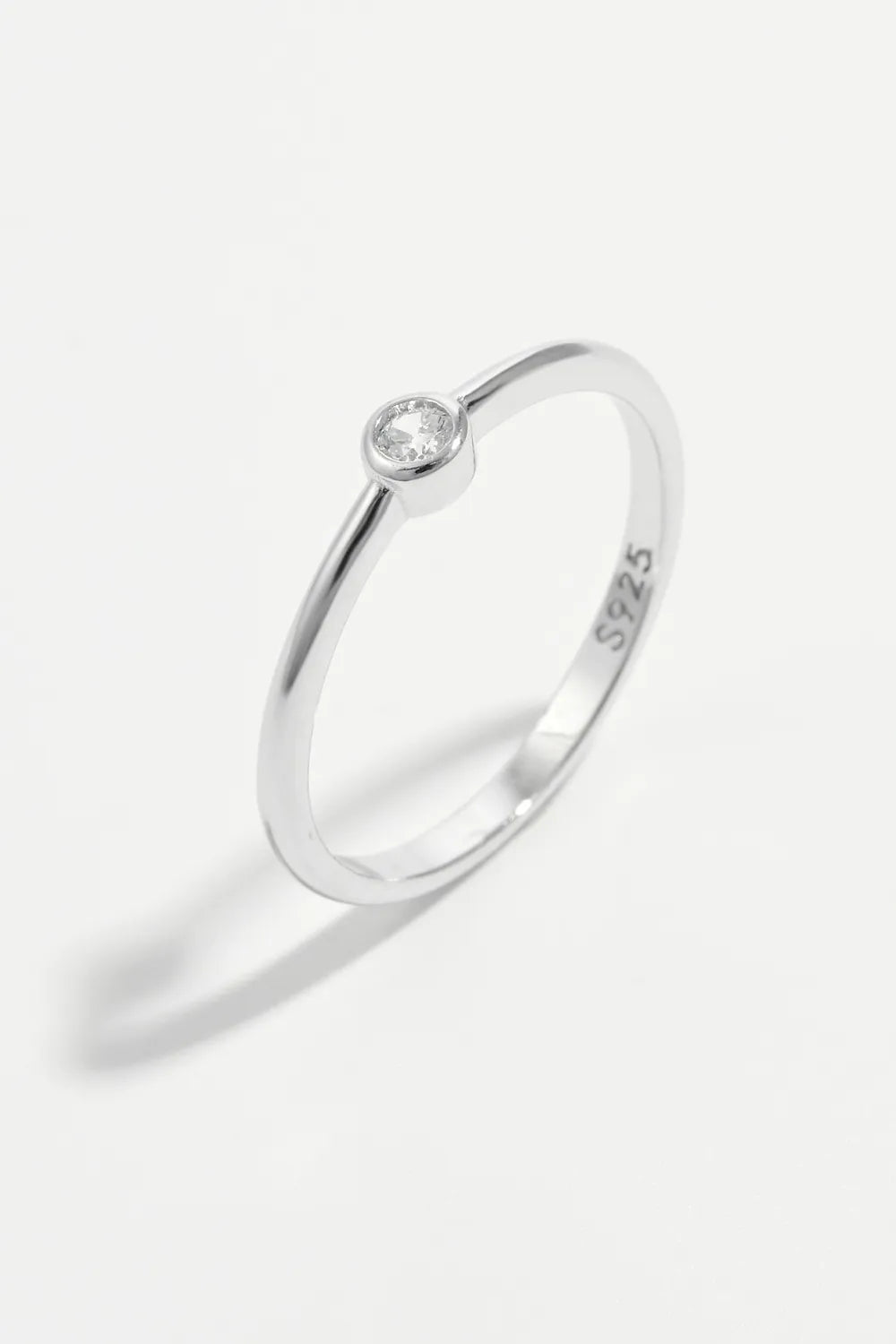 Solitaire silver ring with a single clear zirconia stone on a 925 sterling silver band.