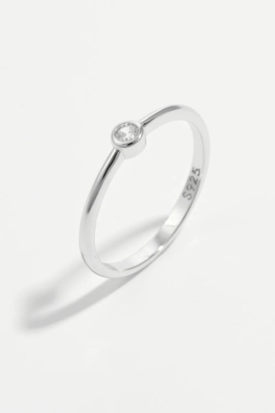 Solitaire silver ring with a single clear zirconia stone on a 925 sterling silver band.