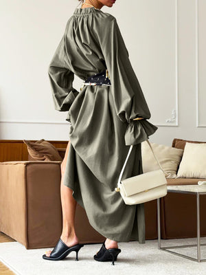 Army green cotton maxi dress with tie neck, ruffled cuffs, and a belted waist.
