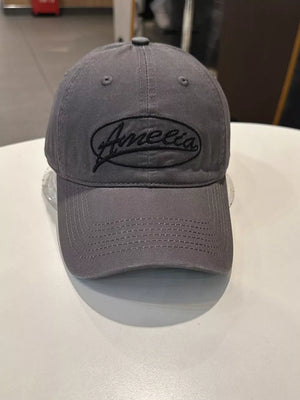Gray baseball cap with black Amelia embroidery and stitched brim.