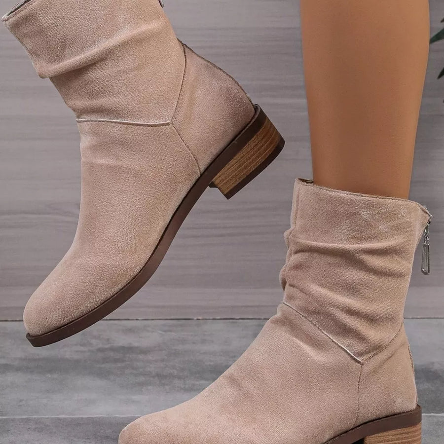 Khaki suede ankle boots with ruched shaft and side zipper detail.