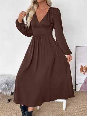 Brown V-neck midi dress with long puff sleeves and an A-line skirt.