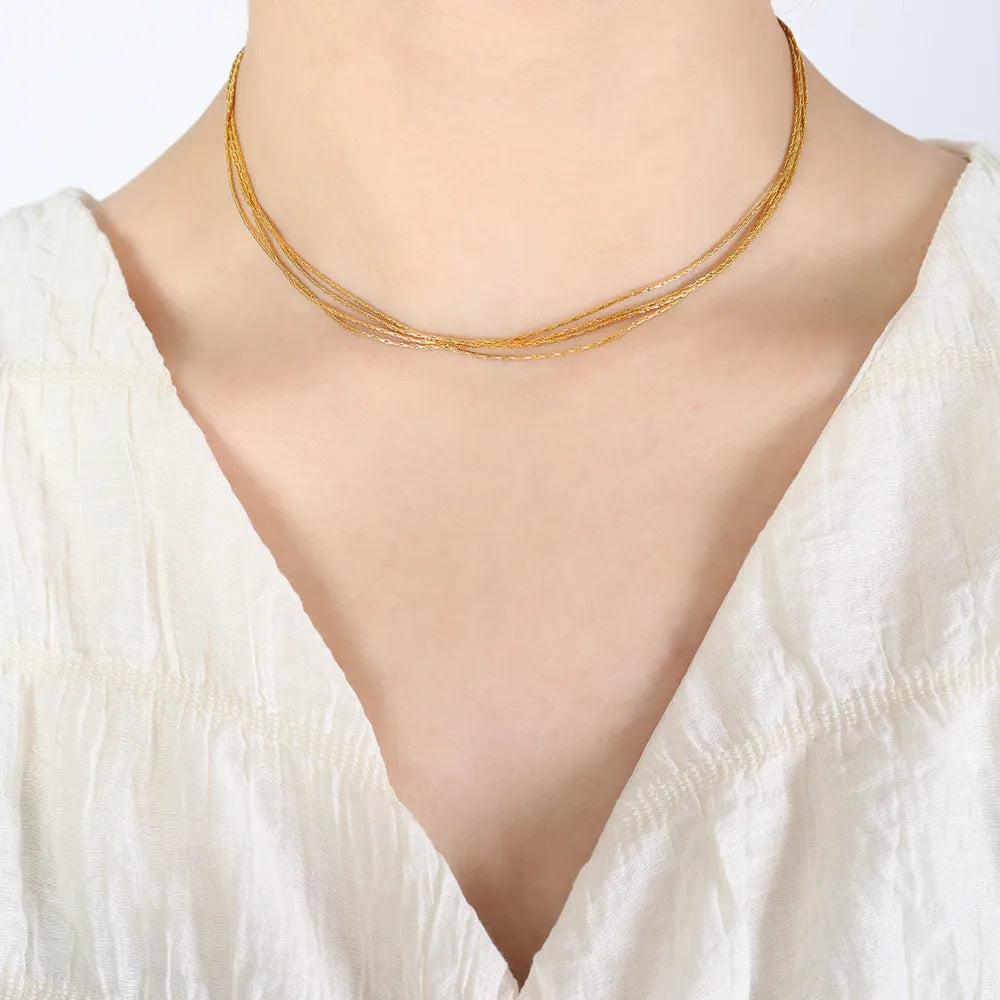 Delicate gold multi-strand collar necklace with fine chains
