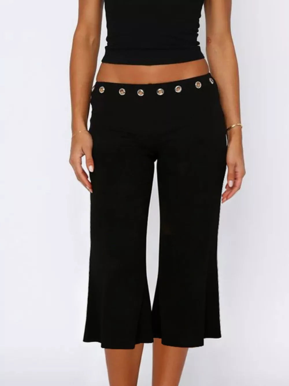 Black maternity capri pants with flared hem and button detail at the waist.