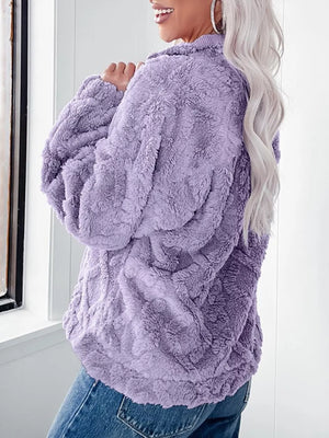 Purple textured fleece quarter zip sweatshirt with a cozy, plush feel.
