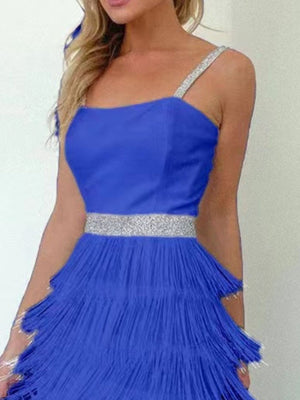 Blue cami mini dress with fringe trim, sequin straps, and sequin waistband.