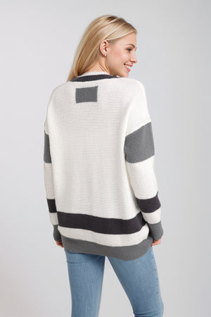 White waffle knit sweater with grey stripes and long sleeves