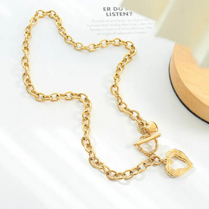 Gold chunky chain necklace with toggle clasp and open heart pendant