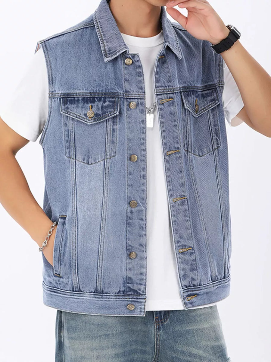 Light wash denim vest for men with button front, collar, and chest pockets.