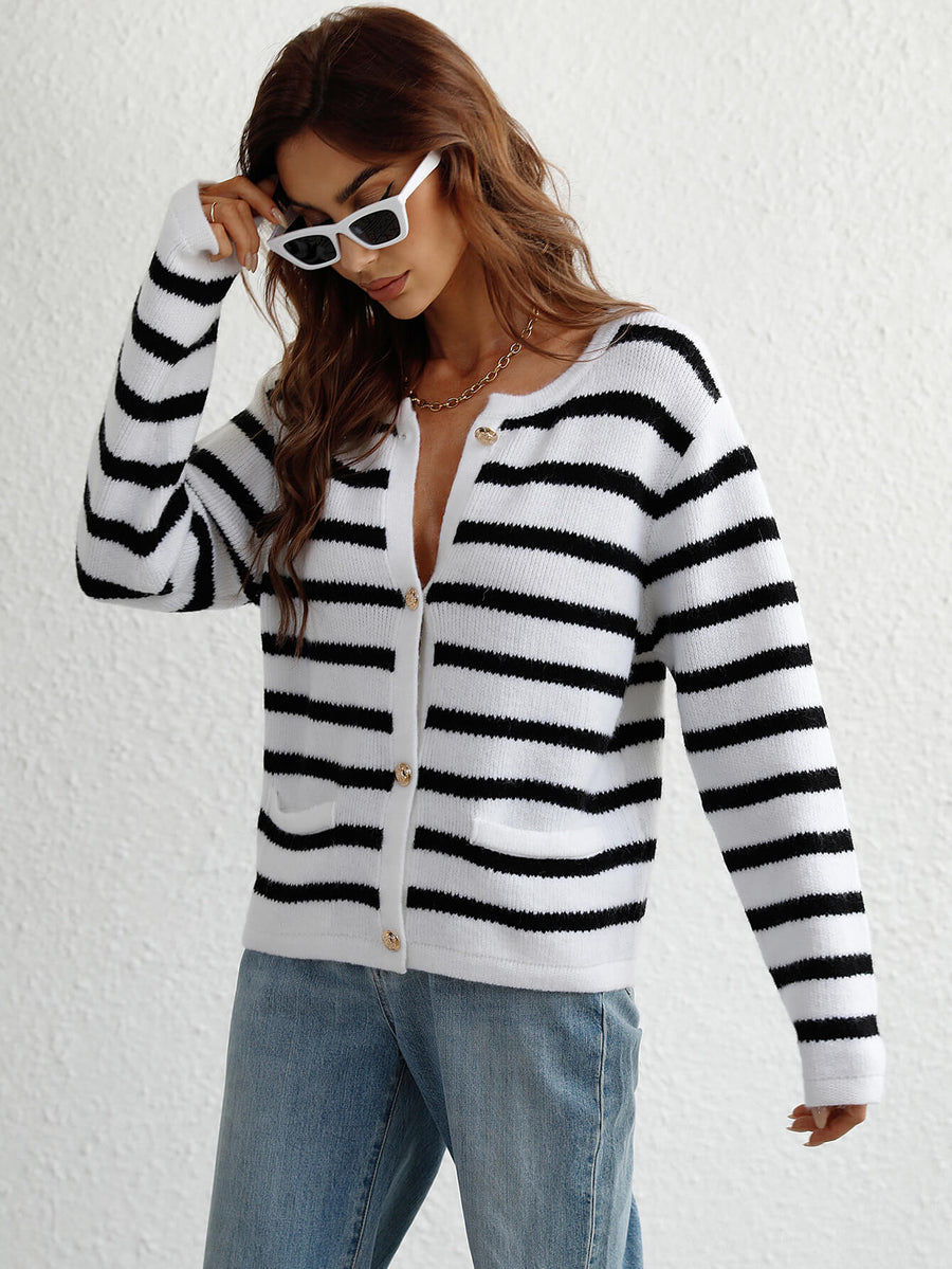 White and black horizontal stripe knit cardigan with pockets and button front.