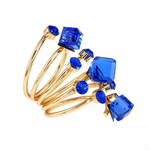 Gold-plated ring with multiple layers and royal blue crystals.