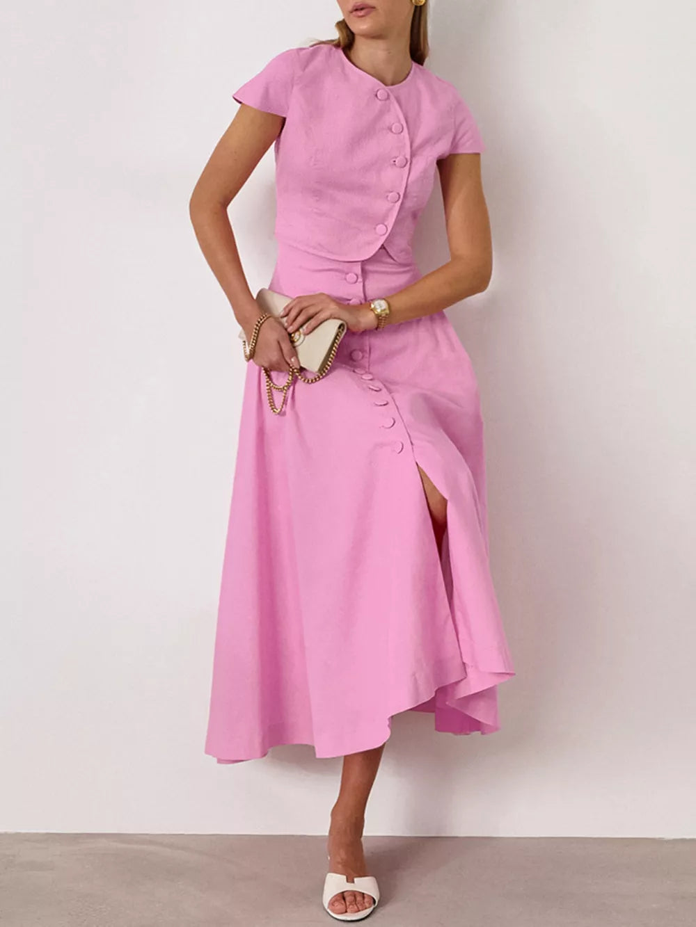 skirt set in blush pink featuring buttoned and fitted top with A-line skirt fit