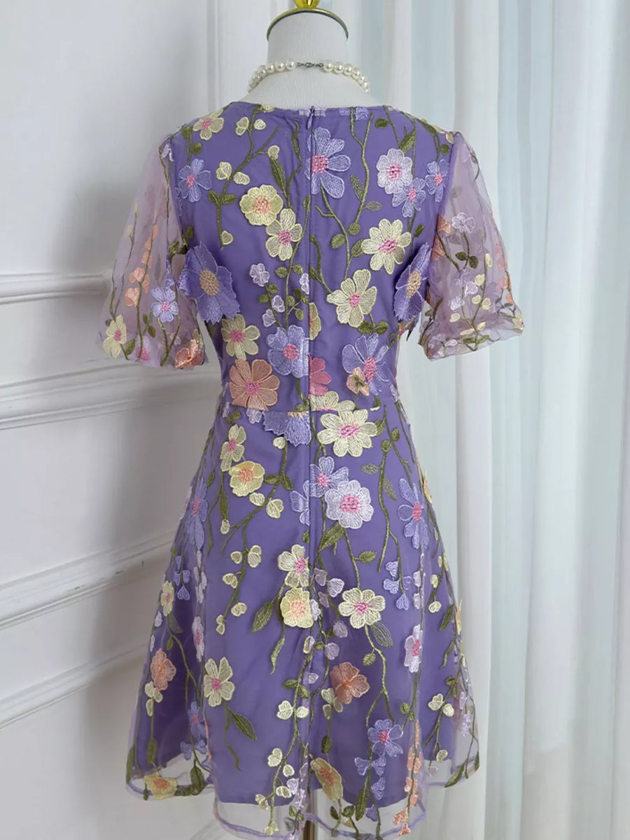 Purple floral embroidered mesh dress with short sleeves and a flared skirt.