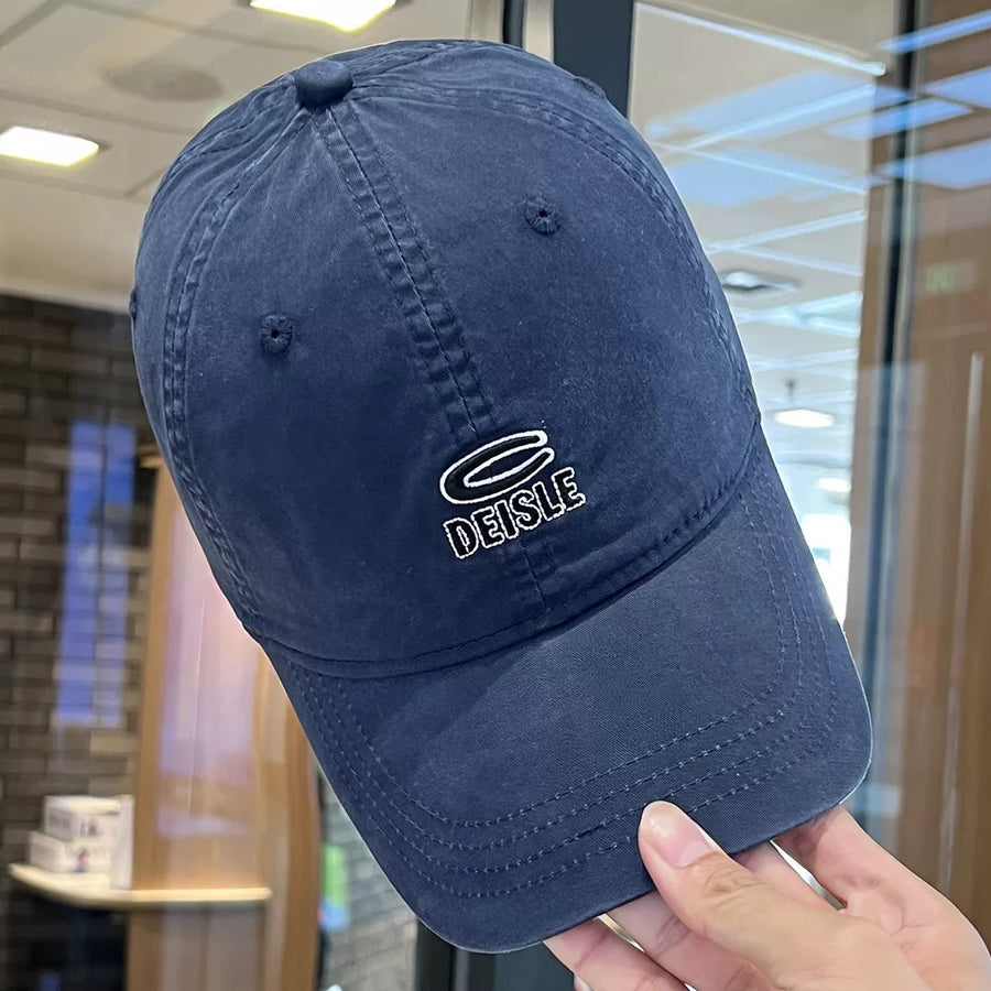 Navy blue baseball cap with embroidered logo detail