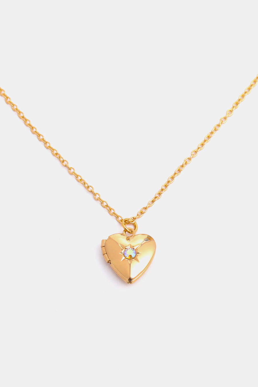 Gold heart locket necklace with iridescent gemstone detail and 14k gold chain