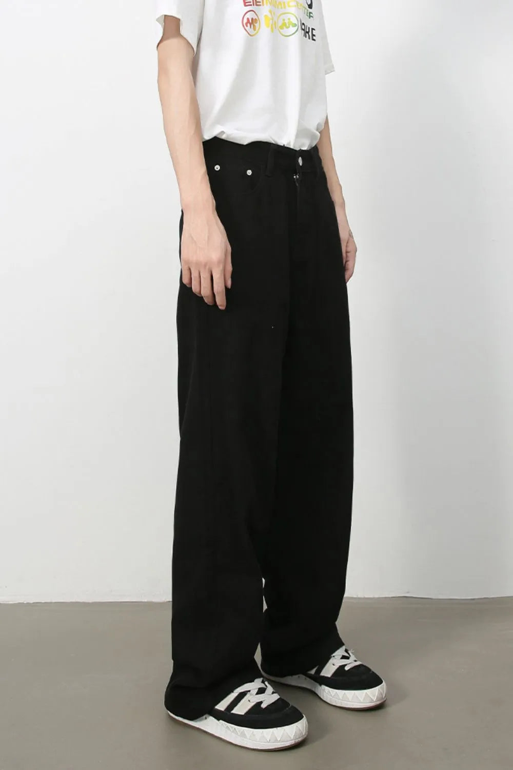 Black wide-leg rigid denim trousers with a relaxed fit.
