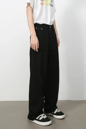 Black wide-leg rigid denim trousers with a relaxed fit.