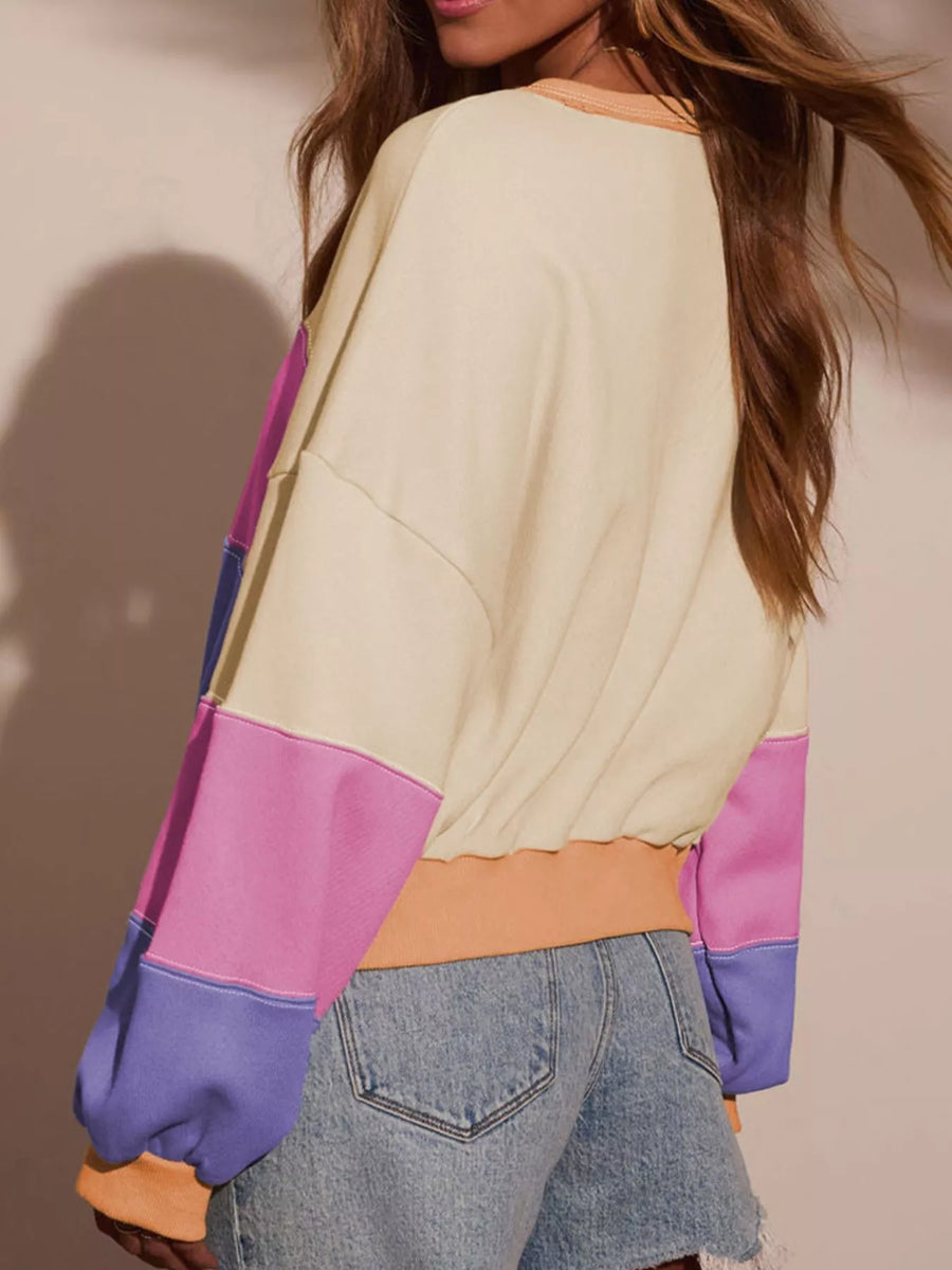 Drop shoulder sweatshirt with multicolor colorblock design and elasticated hem.