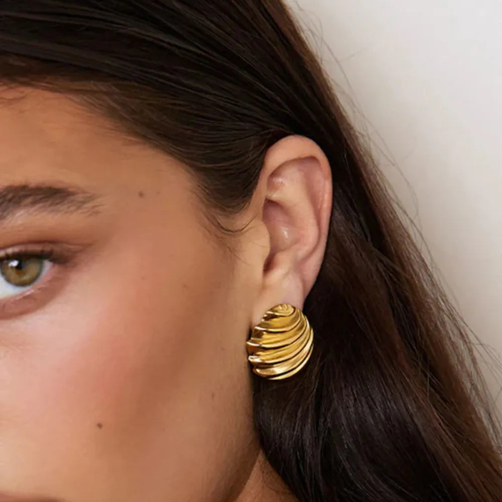 Sculpted spiral gold stud earrings with 18K gold plating.