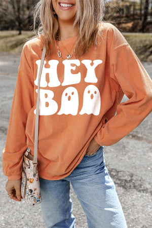 Orange corduroy sweatshirt with white "Hey Boo" ghost graphic.