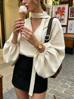 100% polyester Care instructions: Machine wash cold blouse in ivory with relaxed silhouette