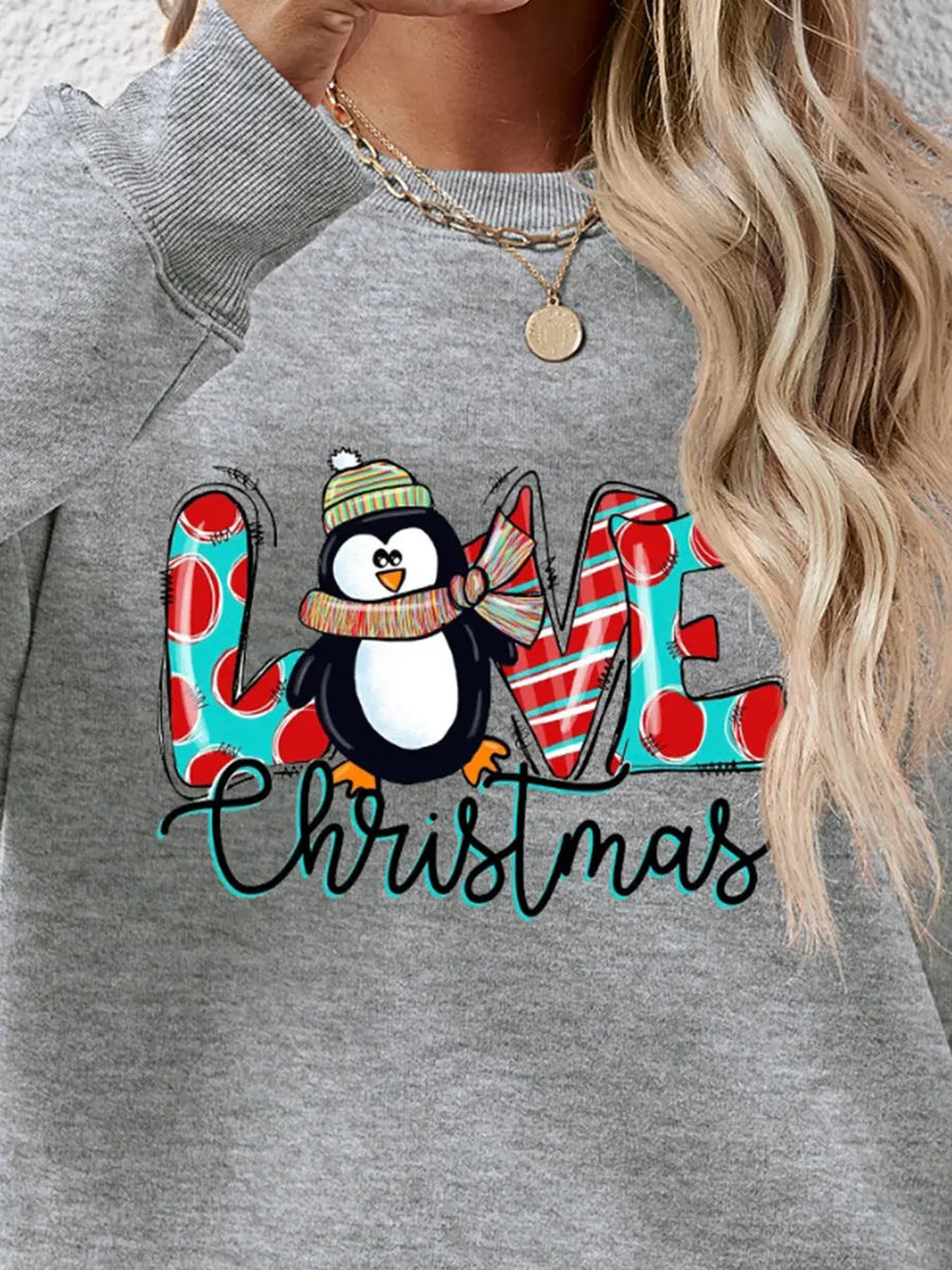 Grey sweatshirt with festive penguin graphic and Christmas text, red polka dots, red and white stripes.