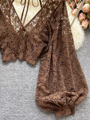 Curry floral lace cropped shirt with balloon sleeves and tie-back detail.