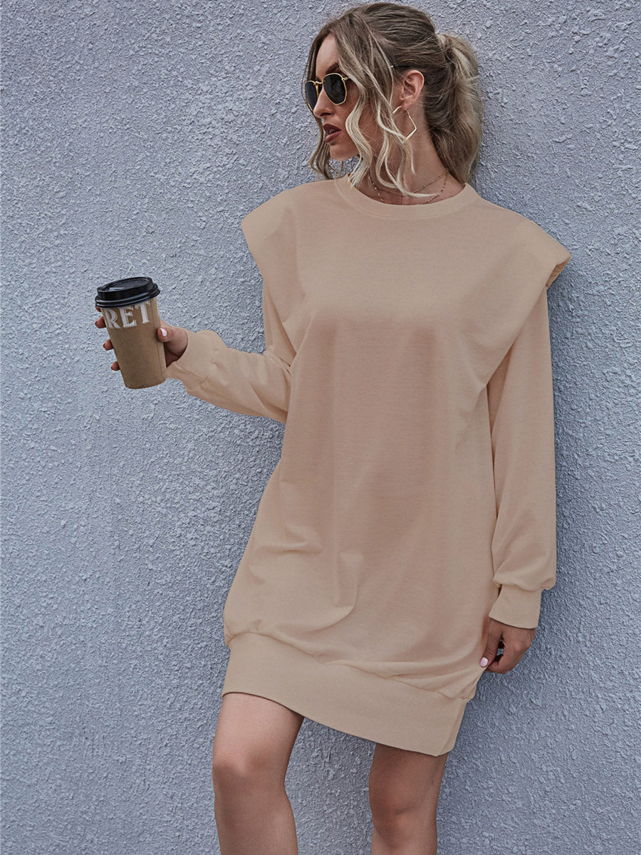 Tan sweatshirt mini dress with padded shoulders and crew neck.
