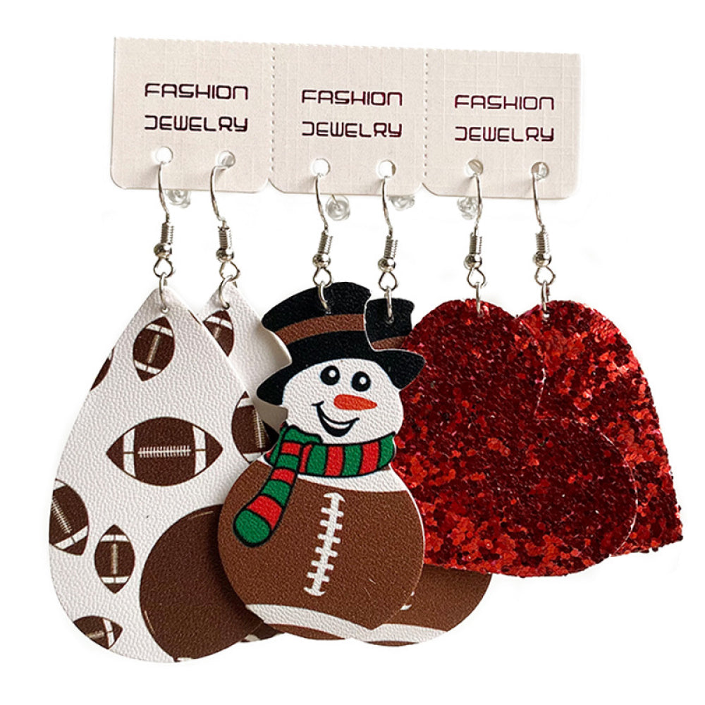 Festive sports trio earrings set with football print, snowman, and red glitter hearts.