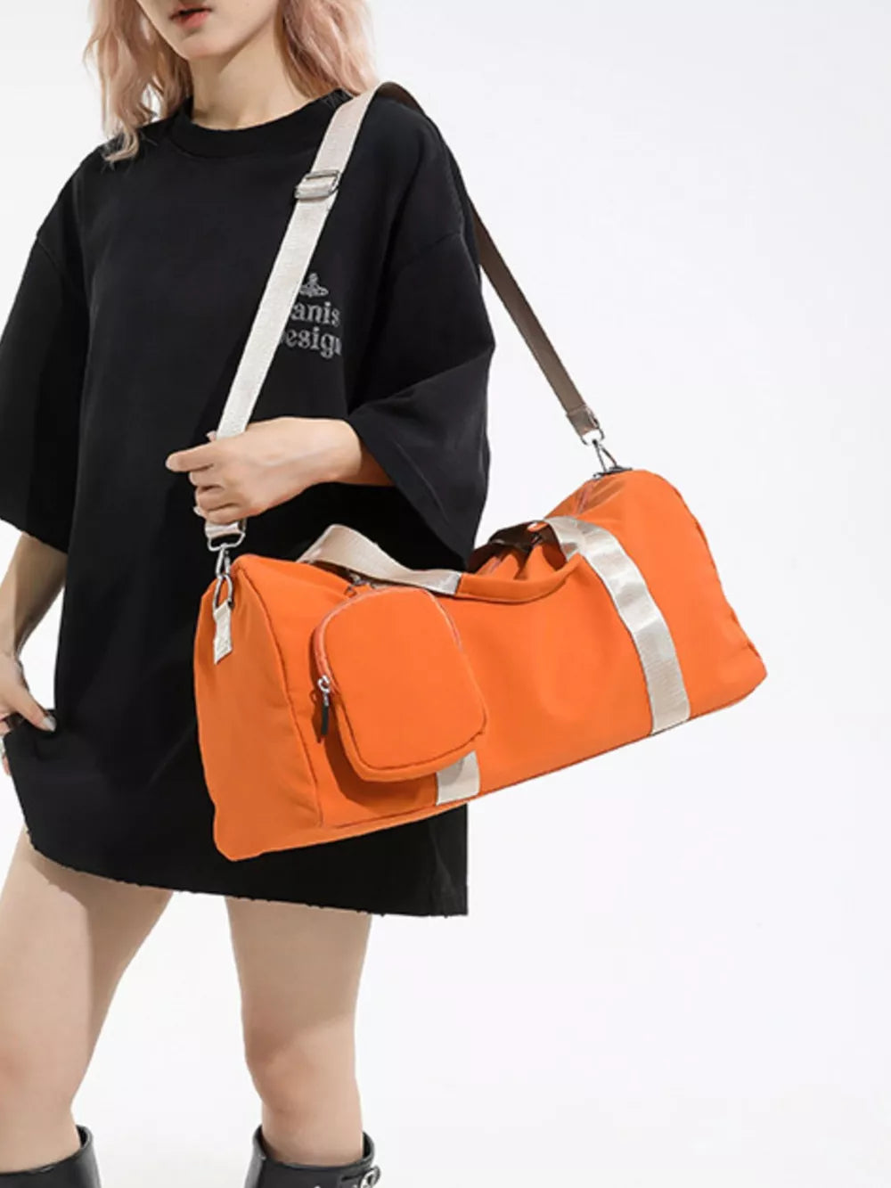 Orange duffle bag with detachable pouch and silver stripe detail.