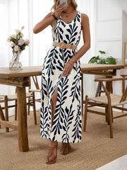 Belted maxi dress with tropical leaf print, V-neck, sleeveless, and front slit.