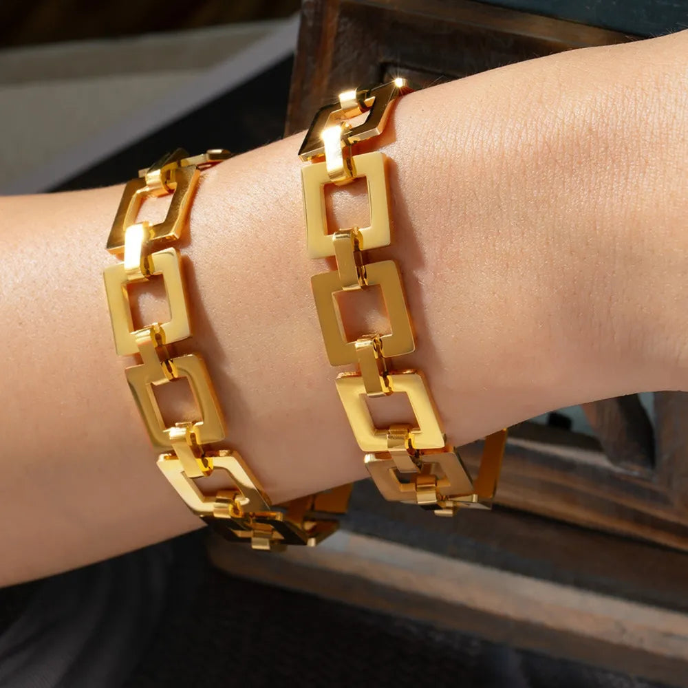 Gold geometric link bracelet with bold square links, 18k gold finish.